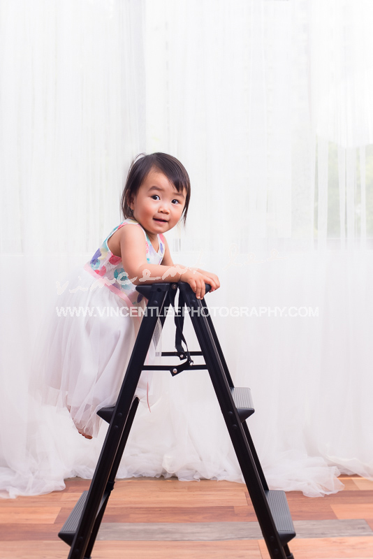 Emily with her favourite ladder and her princess smile