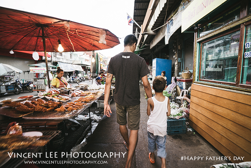 Muay Thai champion boxer with his son to market preparing for dinner 